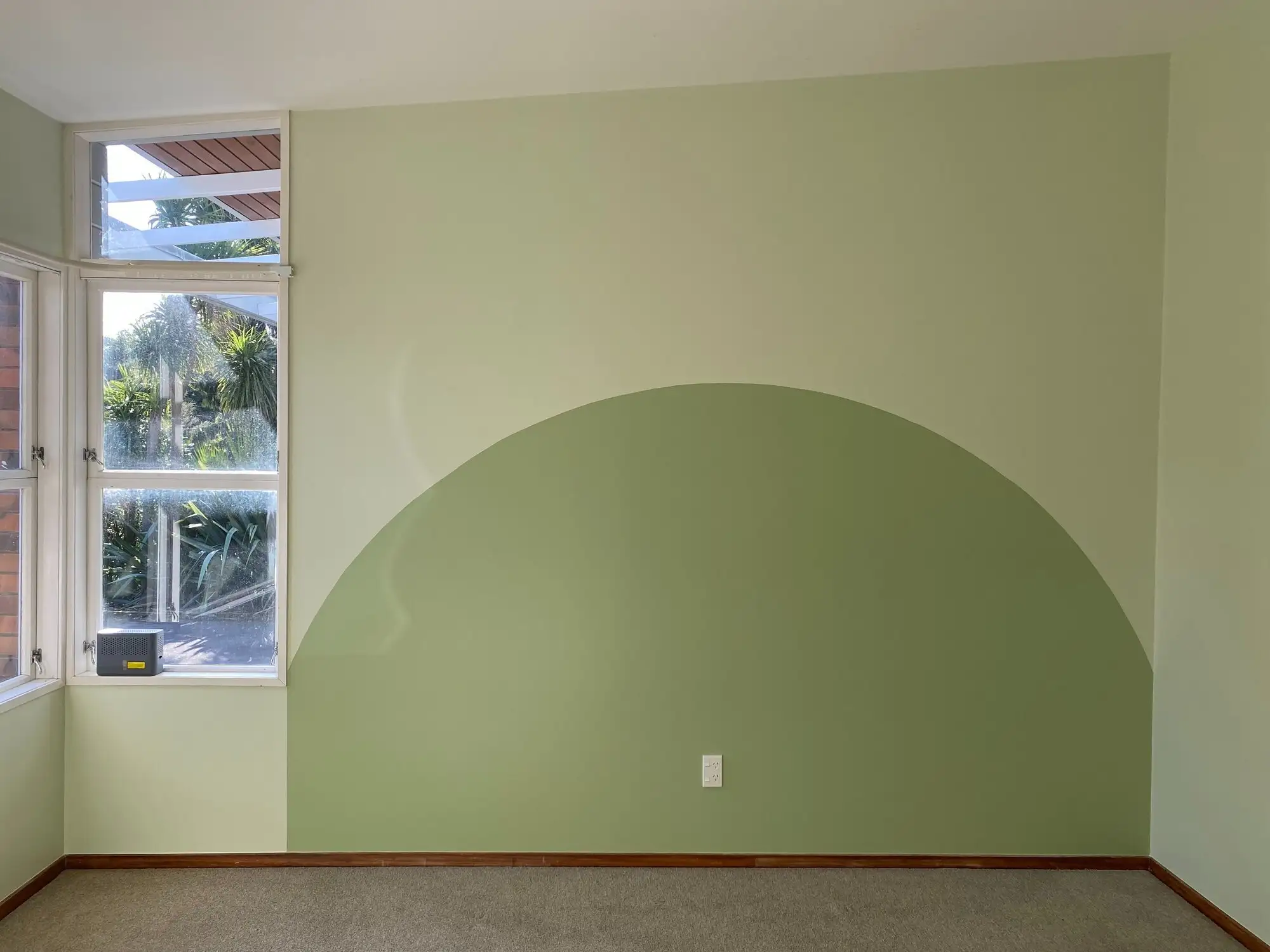 Green painted arch feature wall on a job in Tauranga