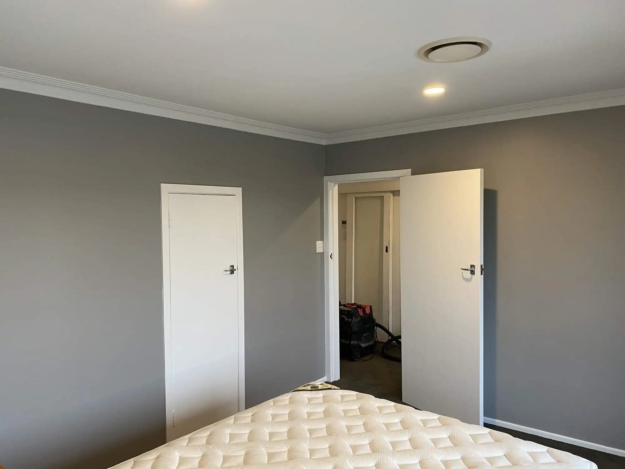 Darraghs Road bedroom in Otumoetai, freshly painted grey with white trim